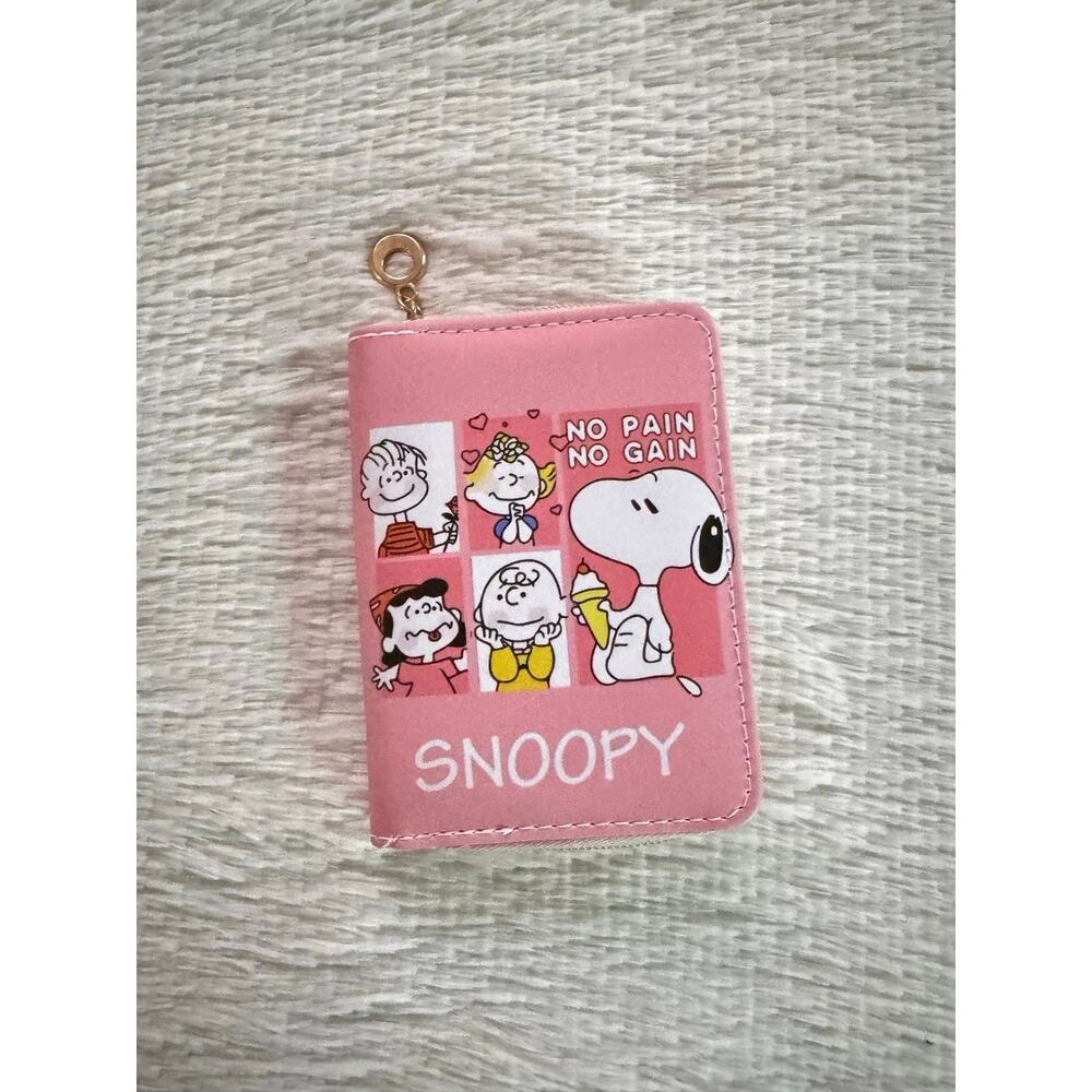 Pink Snoopy wallet with cartoon characters and 'NO PAIN NO GAIN' text
